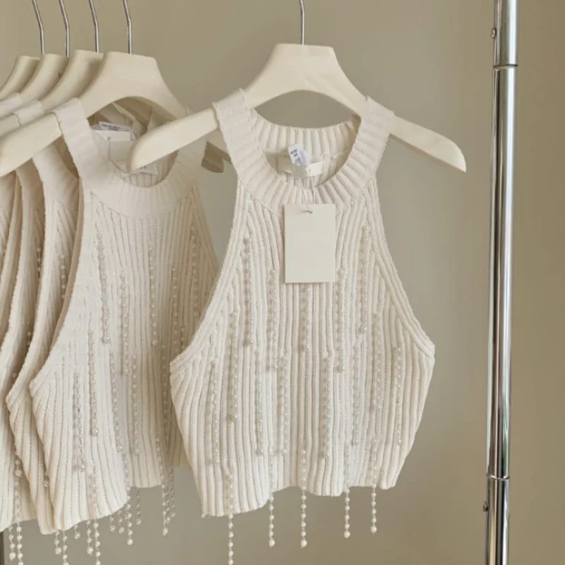 HotSweet Hang Neck Pearl Tassel Vest Women New Sleeveless Small Fragrant White Black Summer Tanks Short Knit Top Feminino 1462
HotSweet Hang Neck Pearl Tassel Vest Women New Sleeveless Small Fragrant White Black Summer Tanks Short Knit Top Feminino 1462