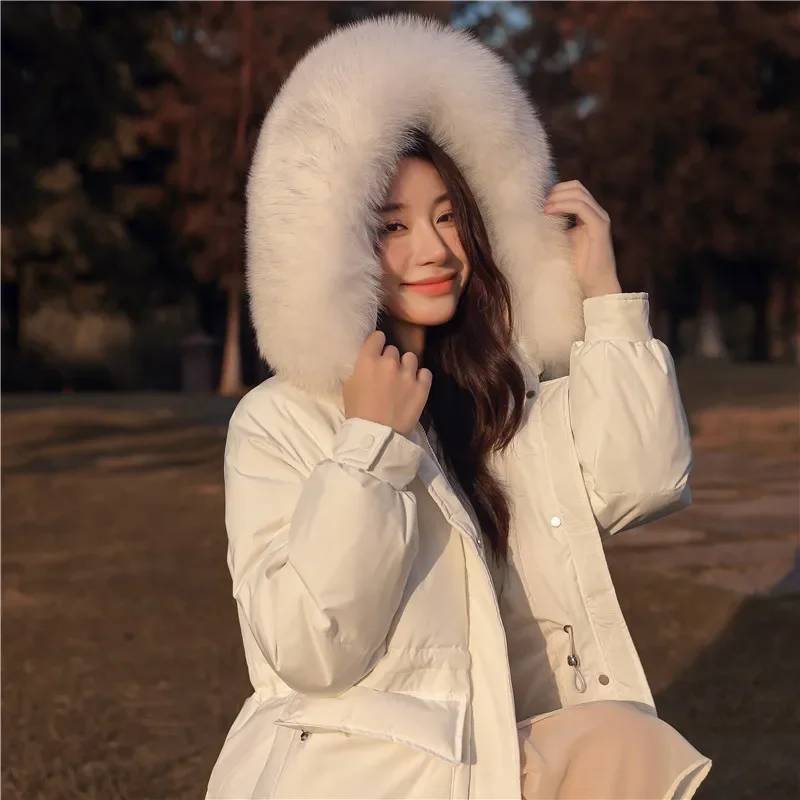 

Waist slimming down jacket women over-the-knee long section 2023 autumn and winter new hooded white duck down padded coat tide.