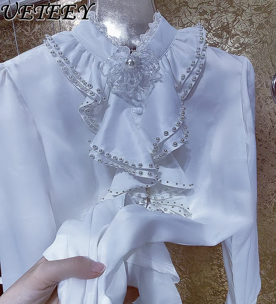 Luxury Fairy Pearl Ruffled Stringy Selvedge Pearl Collar Long-Sleeve Shirt Women's Sweet Flowers White Shirts Autumn Blusas Top
Luxury Fairy Pearl Ruffled Stringy Selvedge Pearl Collar Long-Sleeve Shirt Women's Sweet Flowers White Shirts Autumn Blusas Top