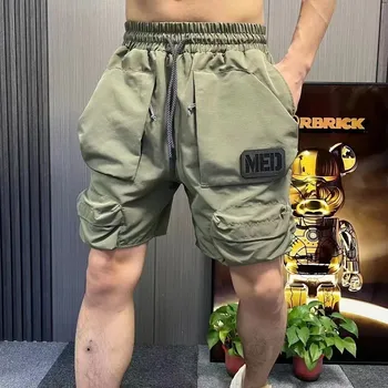 Shorts Cargo Camuflados Masculinos de Multibolsos para o Verão: Elegância e Praticidade 14 Men's Clothing Summer Shorts Pocket Five-Quarter Pants Homme Elastic Waist Cargo Pants Ins Beach Pants Sports Shorts Man Korean