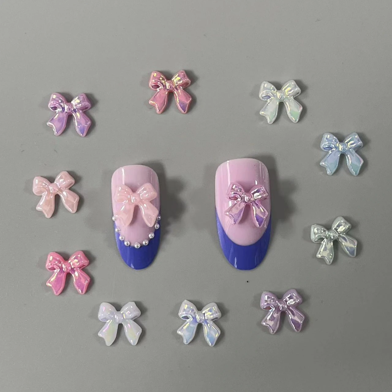 100PCS/Bag Bow Knot AB Colorful Resin Nail Art Decoration Accessories Charms 3D Kawaii 11*1MM Ribbon Nail Jewelry Gems
100PCS/Bag Bow Knot AB Colorful Resin Nail Art Decoration Accessories Charms 3D Kawaii 11*1MM Ribbon Nail Jewelry Gems