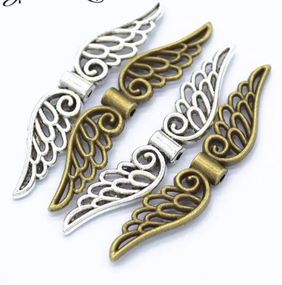40pcs Tibetan Silver Angel Wings Spacer Beads Charms For DIY Jewelry Pendant Accessories Making 52*11mm F0414
40pcs Tibetan Silver Angel Wings Spacer Beads Charms For DIY Jewelry Pendant Accessories Making 52*11mm F0414