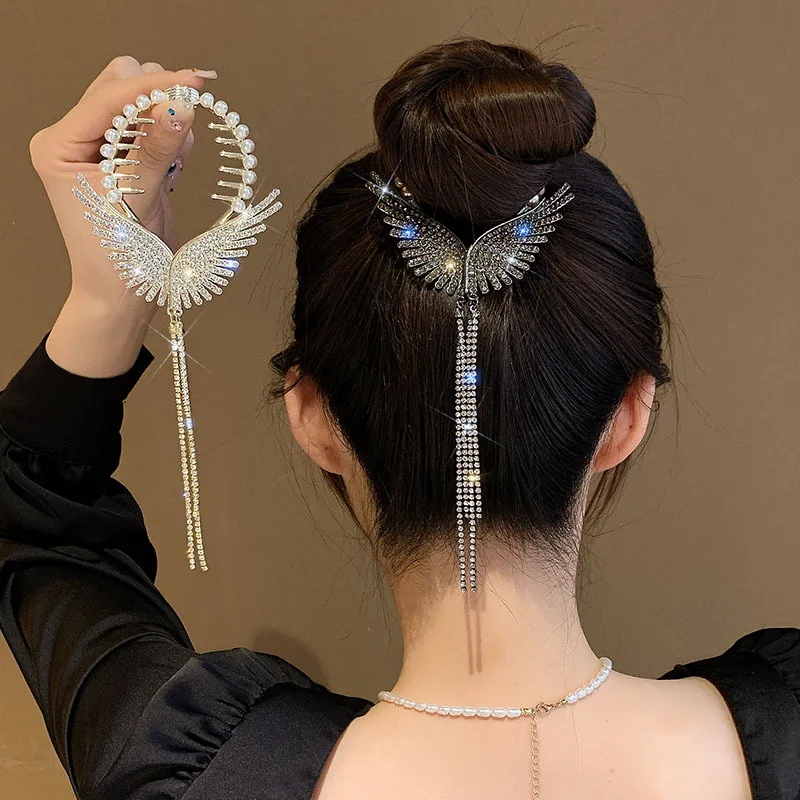 Angel Wings Pearl Rhinestone Tassel High Pill Head Ponytail Buckle Hair Clip Female Korean Hair Bun Elegant Hairpins Accessories
Angel Wings Pearl Rhinestone Tassel High Pill Head Ponytail Buckle Hair Clip Female Korean Hair Bun Elegant Hairpins Accessories