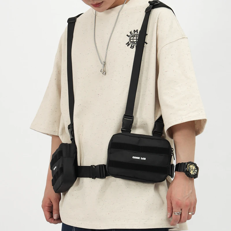 Функциональная сумка-жилет для инструментов, модная брендовая нагрудная сумка, уличная индивидуальная тактическая сумка для жилета, мужская сумка, крутая сумка-мессенджер
Функциональная сумка-жилет для инструментов, модная брендовая нагрудная сумка, уличная индивидуальная тактическая сумка для жилета, мужская сумка, крутая сумка-мессенджер