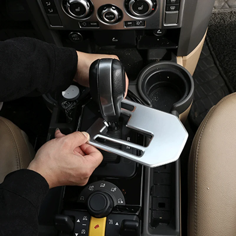 For 2004-2009 Land Rover Discovery 3 LR3 ABS center console shift panel decoration frame sticker car interior accessories 
For 2004-2009 Land Rover Discovery 3 LR3 ABS center console shift panel decoration frame sticker car interior accessories
