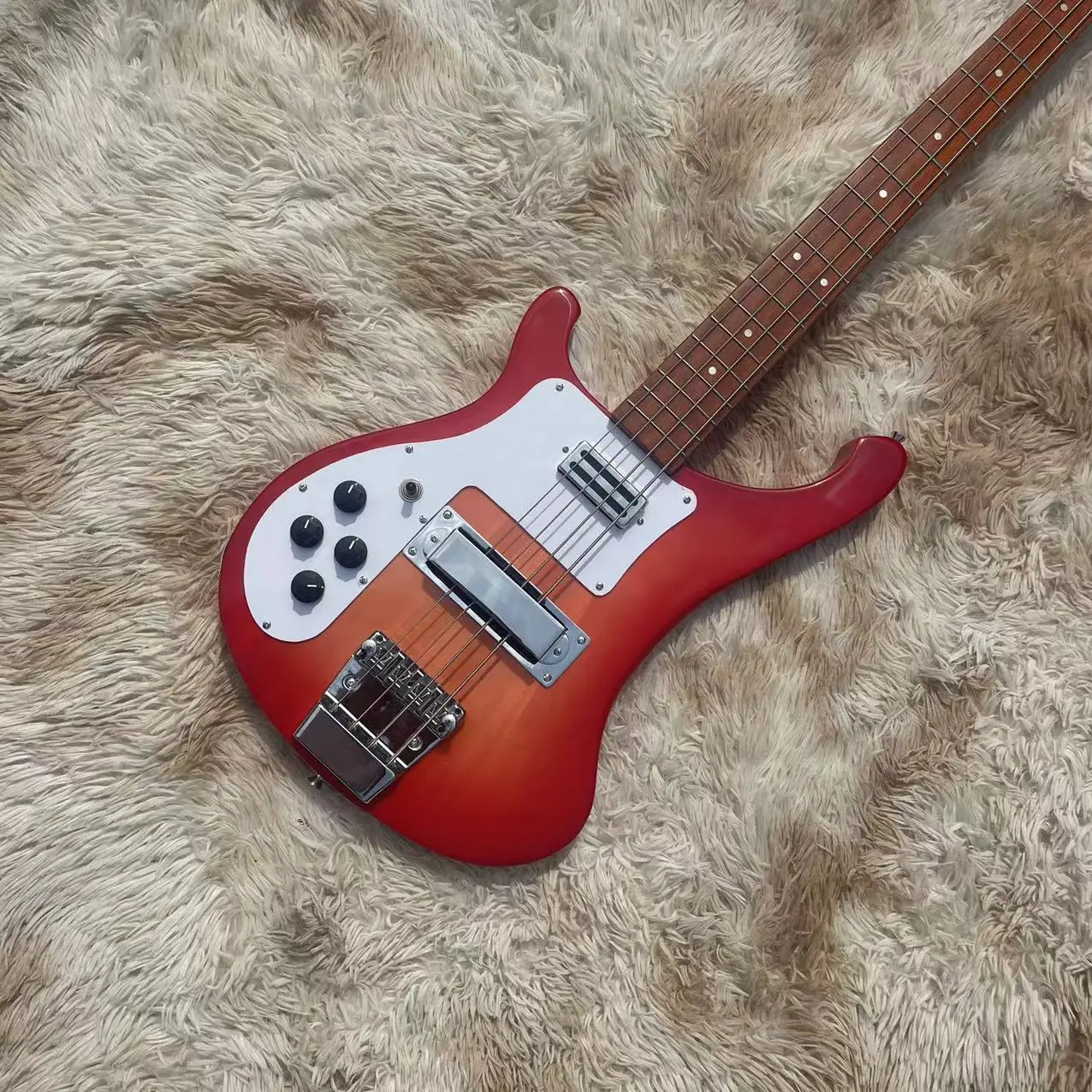 Heterogeneous left hand integrated electric bass, tomato colored piano with high gloss, rose wood fingerboard, point inlay, whit
Heterogeneous left hand integrated electric bass, tomato colored piano with high gloss, rose wood fingerboard, point inlay, whit