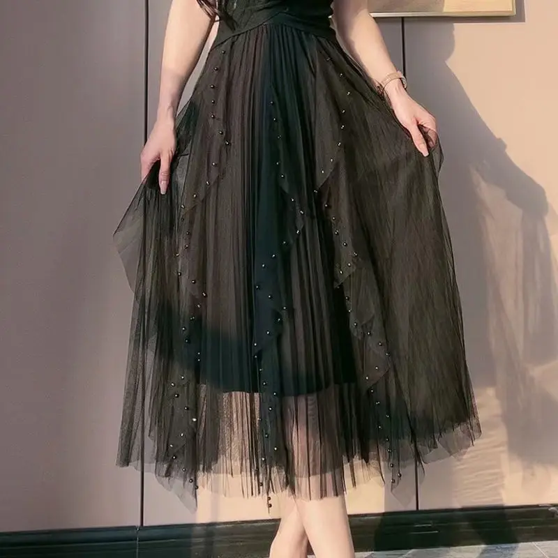 Irregular drape nail bead skirts female summer new product design feeling growing skirt of tall waist show thin gauze
Irregular drape nail bead skirts female summer new product design feeling growing skirt of tall waist show thin gauze