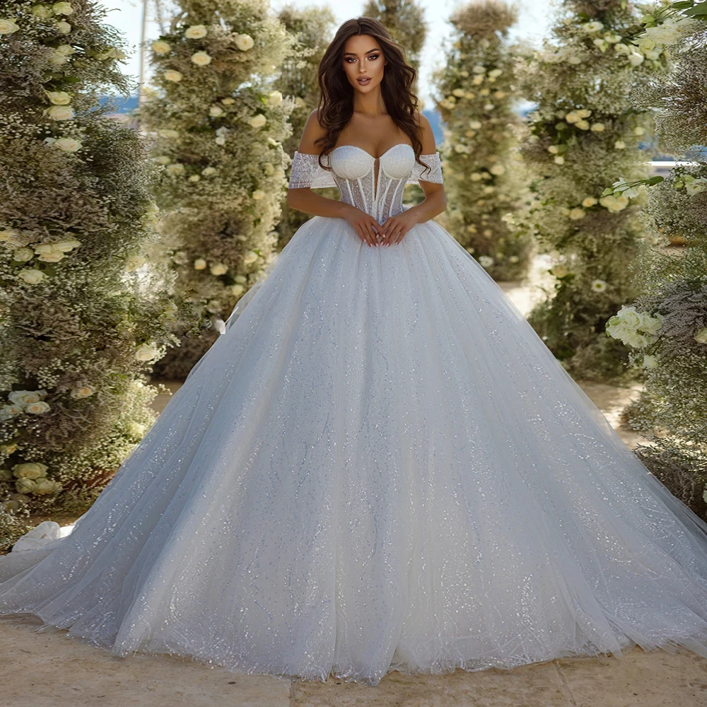 Trouwjurk Shining Wedding Dresses Illusion Bodice Elegant Vestidos De Novia Off Shoulder فساتين طويلة Robe Mariage Bridal Gowns
Trouwjurk Shining Wedding Dresses Illusion Bodice Elegant Vestidos De Novia Off Shoulder فساتين طويلة Robe Mariage Bridal Gowns