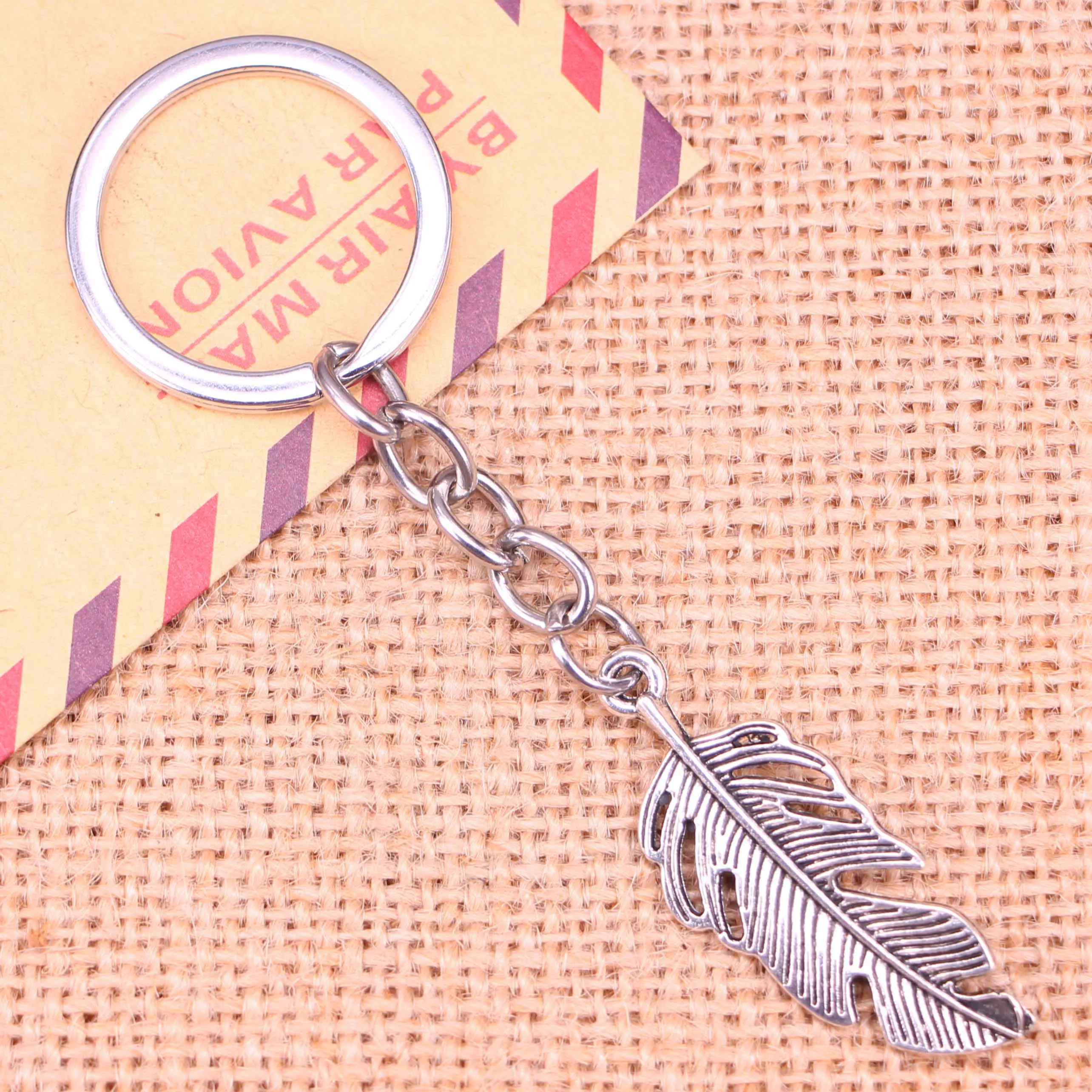 Новинка, модный брелок для ключей 20 шт., 40*16 мм, подвески из перьев, мужские украшения «сделай сам», брелок для ключей автомобиля, сувенирный держатель для подарка
Новинка, модный брелок для ключей 20 шт., 40*16 мм, подвески из перьев, мужские украшения «сделай сам», брелок для ключей автомобиля, сувенирный держатель для подарка