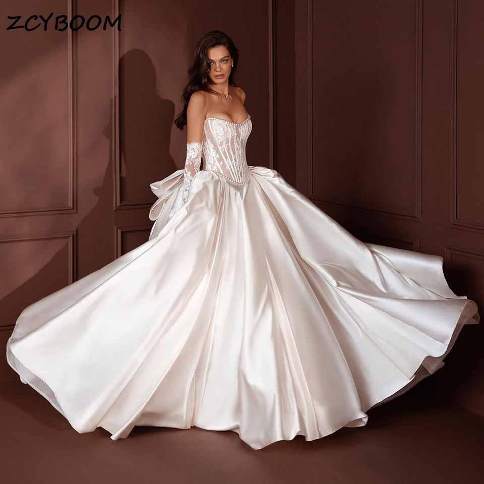 

2024 Gorgeous Strapless Ball Gown Satin Wedding Dress Vintage Sparkly Pearls Beading Sleeveless Lace Women Bridal Gowns With Bow