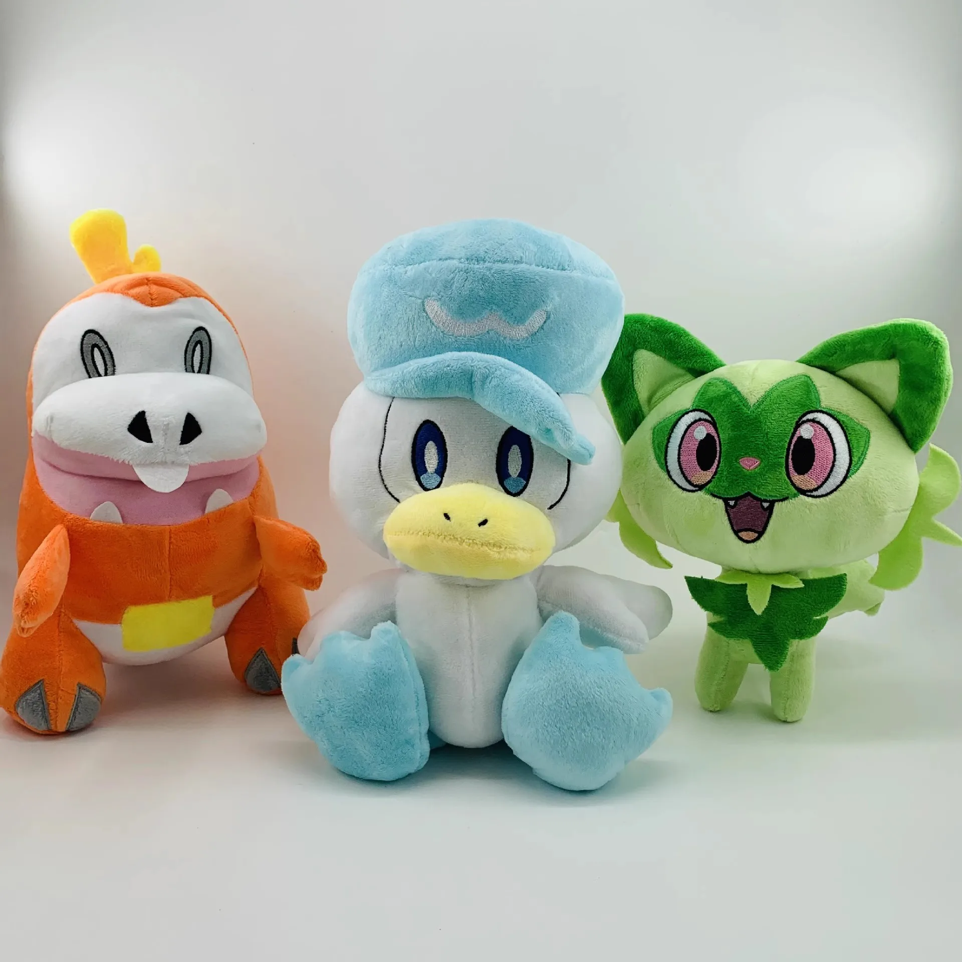 

Pokemon Sprigatito Fuecoco Quaxly New leaf Meow doll New version of the Onsanjia Dumb Fire Crocodile Plush Doll Wet Duck Toy Gif