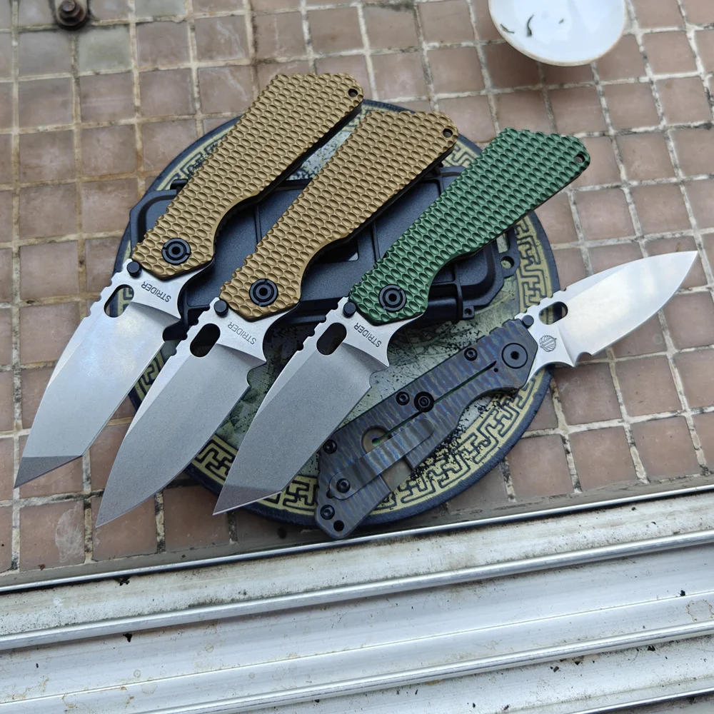 JUFULE анодированный алюминий + титановая ручка TC4 вырезающая полоса SMF медная шайба AUS10 лезвие складной нож для кемпинга охоты EDC инструмент
JUFULE анодированный алюминий + титановая ручка TC4 вырезающая полоса SMF медная шайба AUS10 лезвие складной нож для кемпинга охоты EDC инструмент