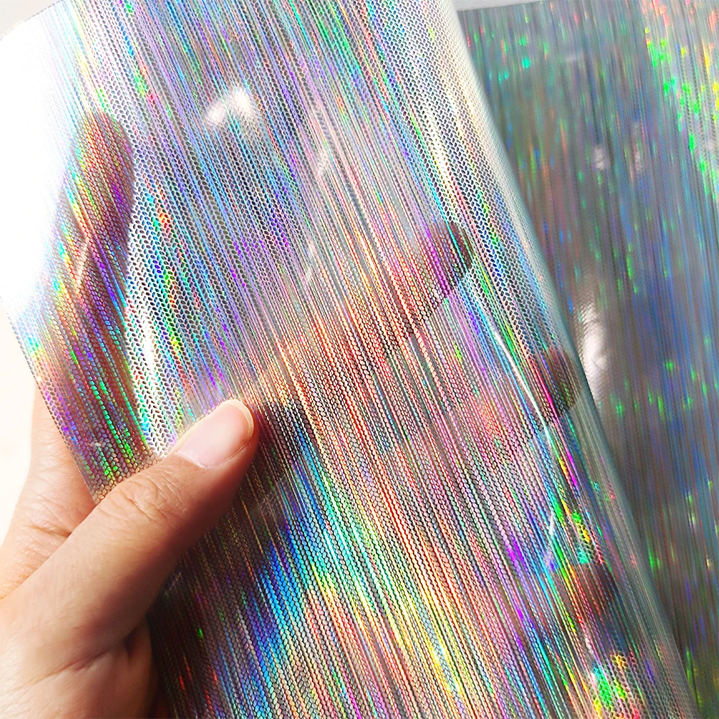 

Patterned Transparent Printed PVC Holographic Faux Leather Sheets Laser Vinyl Fabric for raincoat and clear umbrella DIY crafts