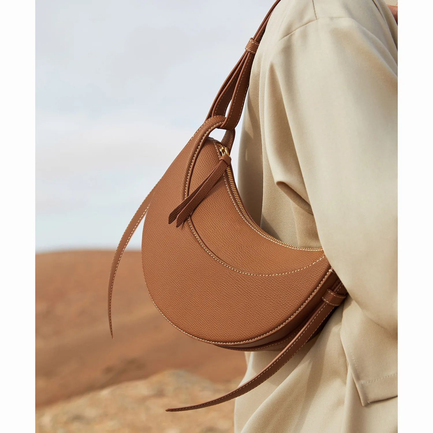 

Parisian-style niche 10A semicircle bag Number ten first-tier leather one-shouldered armpit saddle bag woman bag