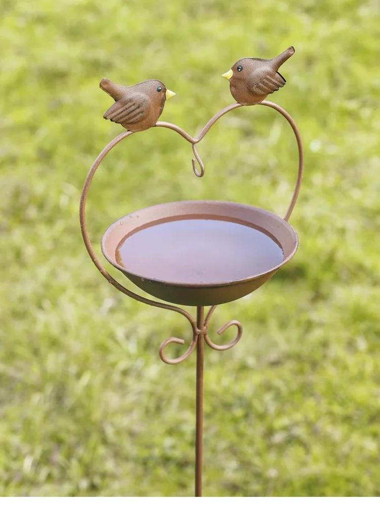 Lovely bird rainwater collection feeding bird glass tube water feeder wrought iron flowers inserted rust-like garden ornaments.
Lovely bird rainwater collection feeding bird glass tube water feeder wrought iron flowers inserted rust-like garden ornaments.