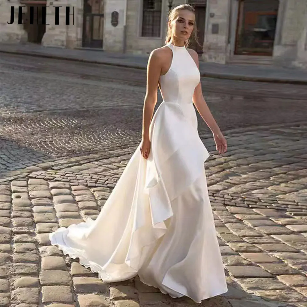 JEHETH Elegant Backless Sleeveless Bridal Gowns 2024 Charming Halter Neck Satin Wedding Dresses Simple A-Line Vestidos De Noiva
JEHETH Elegant Backless Sleeveless Bridal Gowns 2024 Charming Halter Neck Satin Wedding Dresses Simple A-Line Vestidos De Noiva
