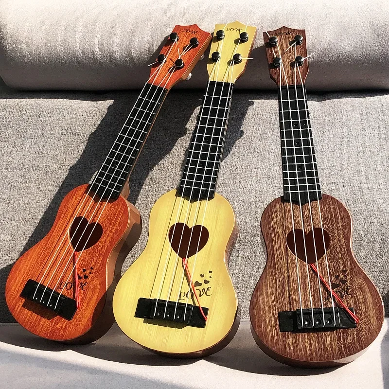 

Mini Four Strings Children Guitar Toy Beginners Ukulele Musical Instruments Simulation Playing Early Educational Toys for Kids