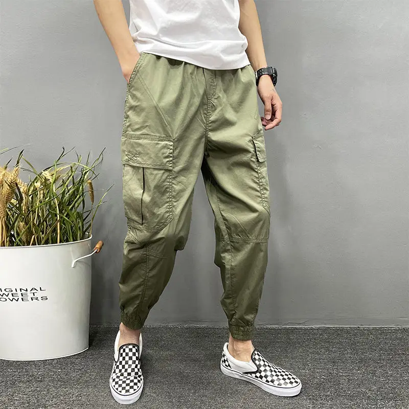 

2024 Spring/Summer New Men's Casual Trend Solid Color Pocket Drawstring Paired with Loose Feet Versatile 9-point Harlan Pants