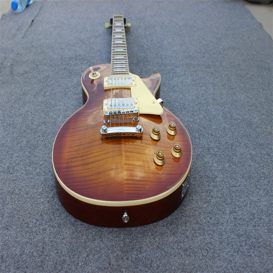 High quality electric guitar, brown and yellow color, flame tiger print, silver hardware, free delivery, can be customized
High quality electric guitar, brown and yellow color, flame tiger print, silver hardware, free delivery, can be customized