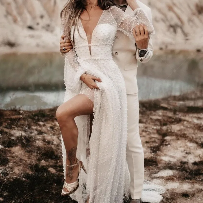 2023 Luxury Pearl Tulle Boho Beach Wedding Dresses Sexy V Neck Backless Lantern Sleeves Bridal Gowns For Bride Robe De Mariée
2023 Luxury Pearl Tulle Boho Beach Wedding Dresses Sexy V Neck Backless Lantern Sleeves Bridal Gowns For Bride Robe De Mariée