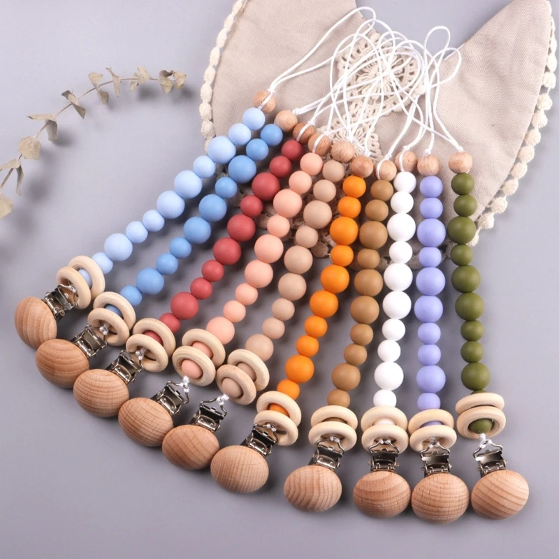 Wooden Nipple Clip Teething Bead Pacifier Anti-Lost Chain Soother Clip Baby Teether Toy Hanging-Clip Nursing Accessories
Wooden Nipple Clip Teething Bead Pacifier Anti-Lost Chain Soother Clip Baby Teether Toy Hanging-Clip Nursing Accessories