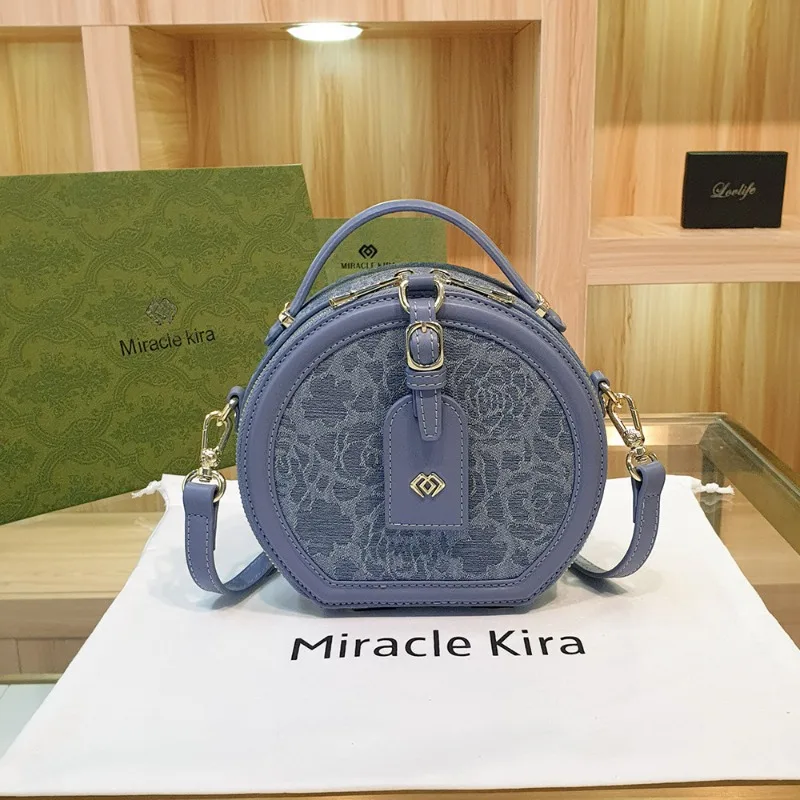 Новинка Осень/Зима 2023, повседневная Универсальная круглая сумка Miracle Kira, ручная сумка через плечо для отдыха, искусственная кожа
Новинка Осень/Зима 2023, повседневная Универсальная круглая сумка Miracle Kira, ручная сумка через плечо для отдыха, искусственная кожа