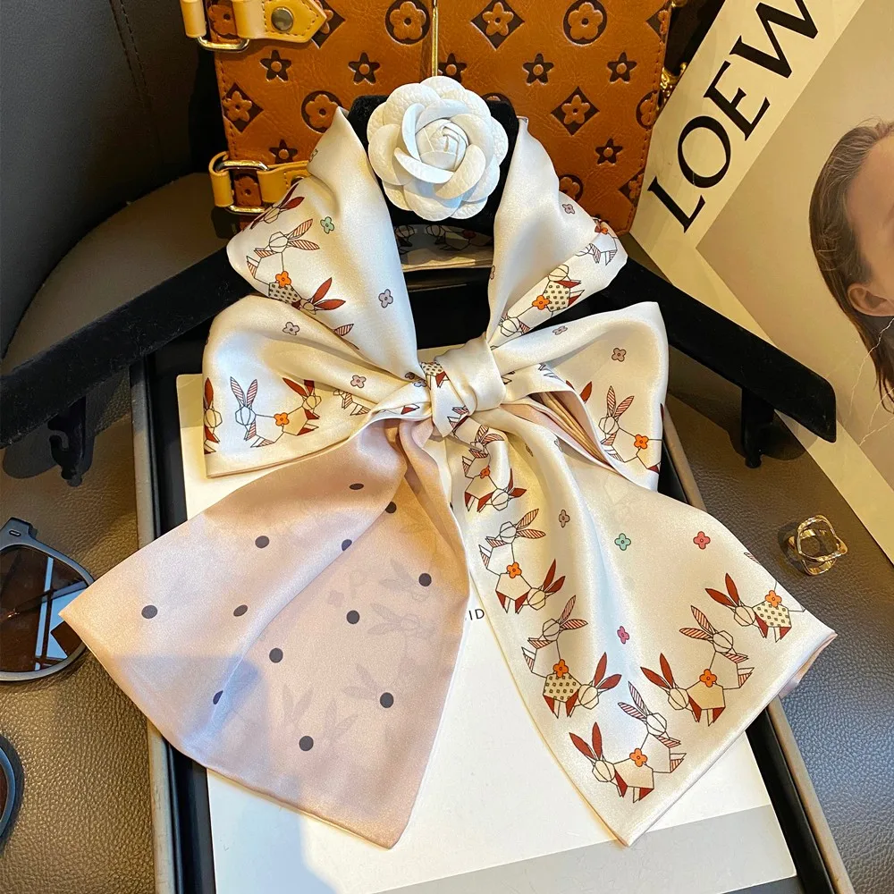 

High-grade silk scarf women in the spring and autumn of 2024, the new western-style fashion small long bow ribbon silk Joker hea