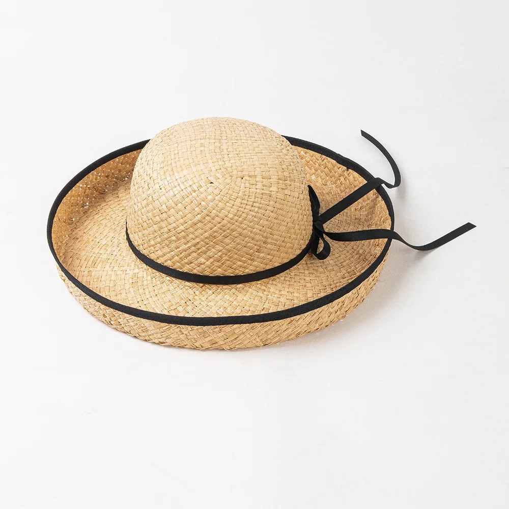 

Korean version of the new fashion lashing bow rolled edge Raffia basin hat outdoor travel sun protection visor straw hat