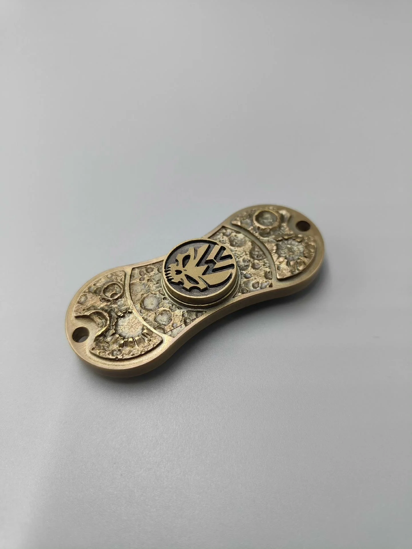 

Even number engraving tor fingertip gyroscope made of brass material