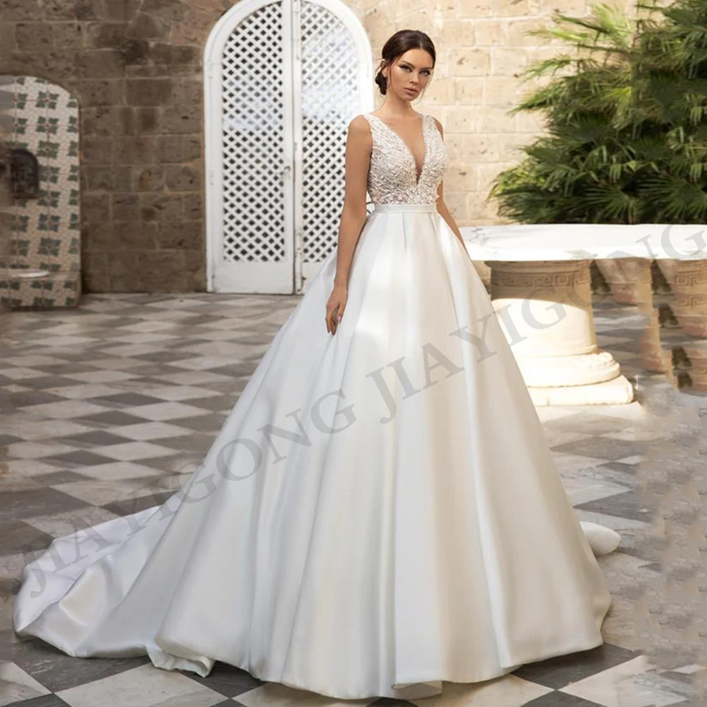 Wedding Dress A Line V-Neck Illusion Back Buttons Lace Appliques Sequined Beads Satin Sweep Train Bridal Gown Vestido De Novia
Wedding Dress A Line V-Neck Illusion Back Buttons Lace Appliques Sequined Beads Satin Sweep Train Bridal Gown Vestido De Novia