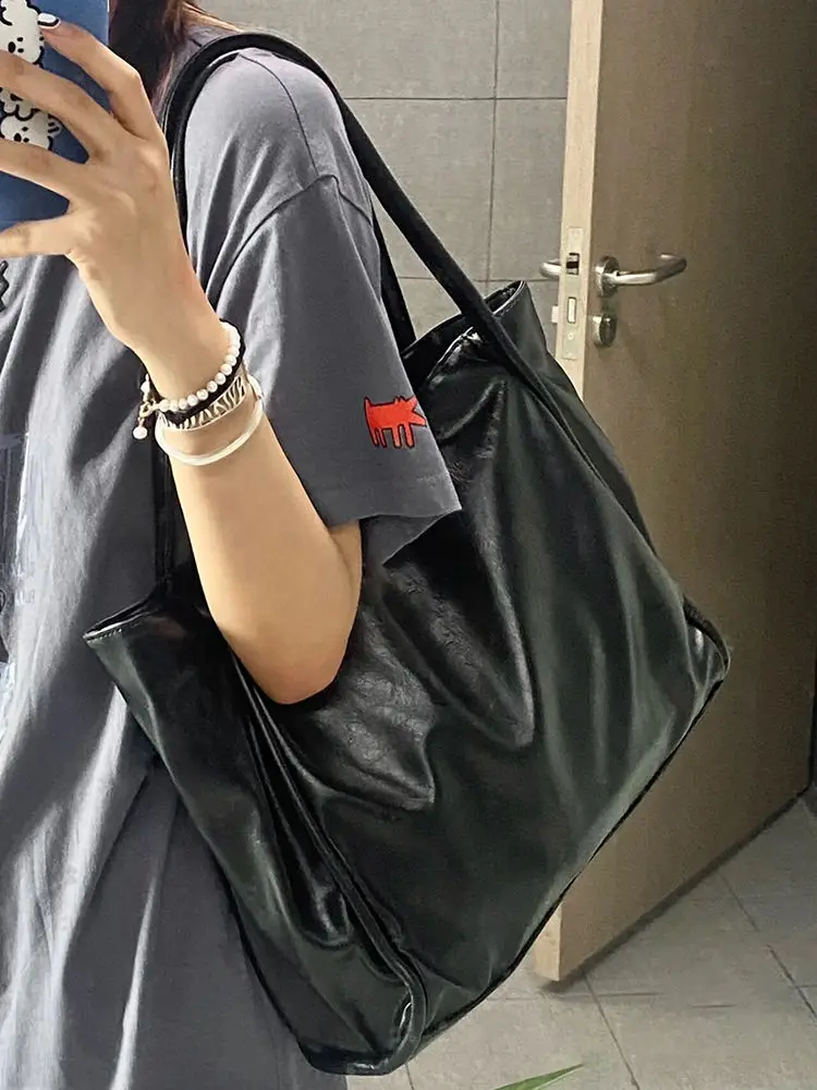 

Autumn and winter bags women 2024 new hand-held texture large-capacity tote bag niche design single shoulder armpit commuter bag