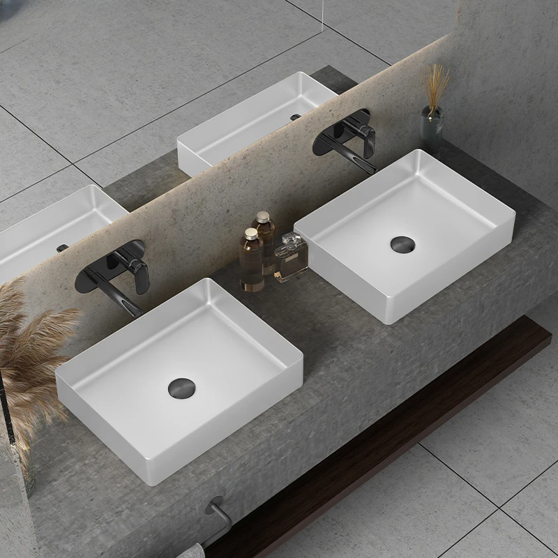 Painted white stainless steel countertop basin net red bar creative art washbasin
Painted white stainless steel countertop basin net red bar creative art washbasin