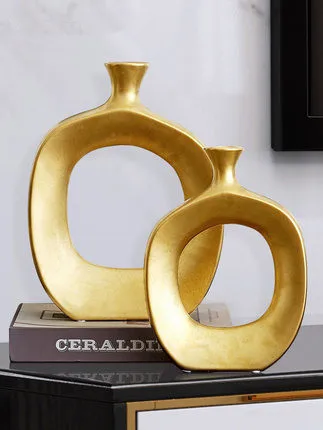 Nordic golden ceramic vase modern home decoration ornaments countertop vase creative living room flower arrangement vase
Nordic golden ceramic vase modern home decoration ornaments countertop vase creative living room flower arrangement vase