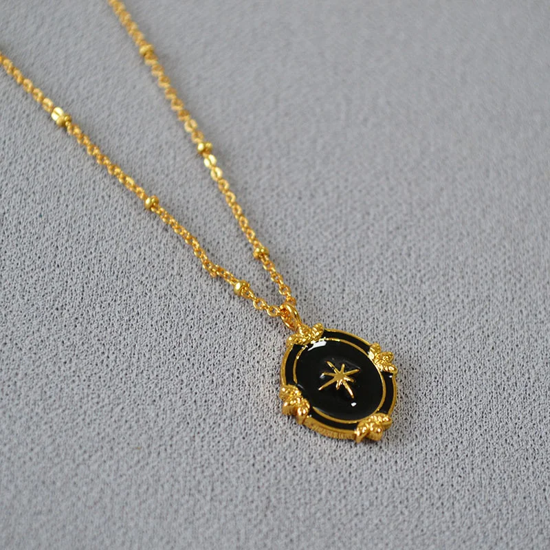 French niche personality simple and elegant black night sky enamel palace style North Star oval pendant short necklace
French niche personality simple and elegant black night sky enamel palace style North Star oval pendant short necklace