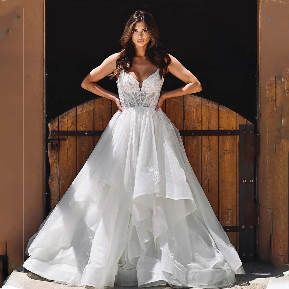 Elegant Spaghetti Straps V-neck Lace Applique Tiered Organza Wedding Dresses Custom Made Bridal Grown 2025 Vestido De Noival
Elegant Spaghetti Straps V-neck Lace Applique Tiered Organza Wedding Dresses Custom Made Bridal Grown 2025 Vestido De Noival