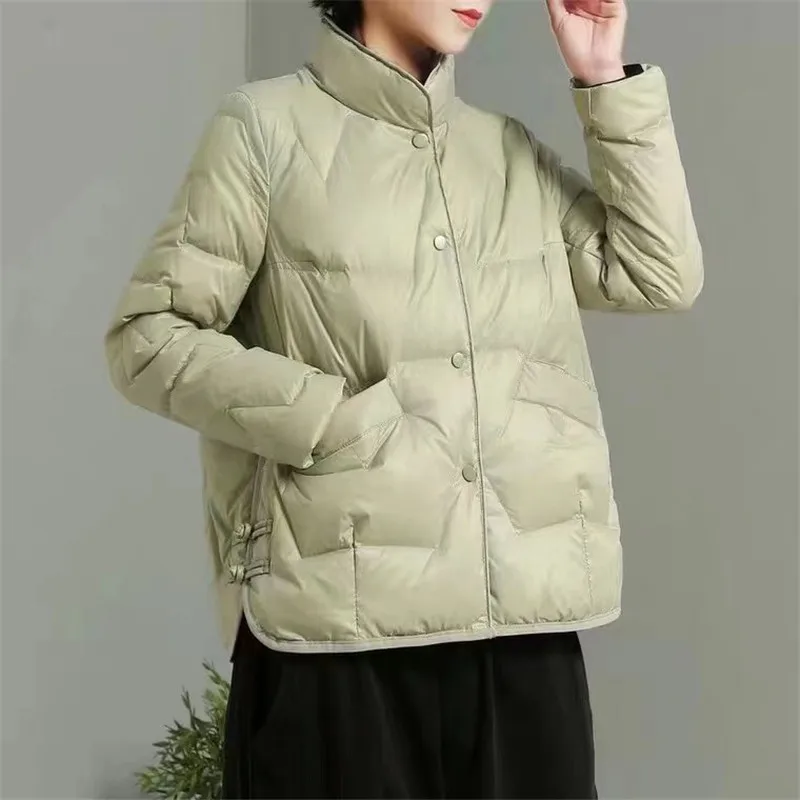 2022 new thin down jacket women loose short stand collar solid color long sleeve single breasted women's coat
2022 new thin down jacket women loose short stand collar solid color long sleeve single breasted women's coat