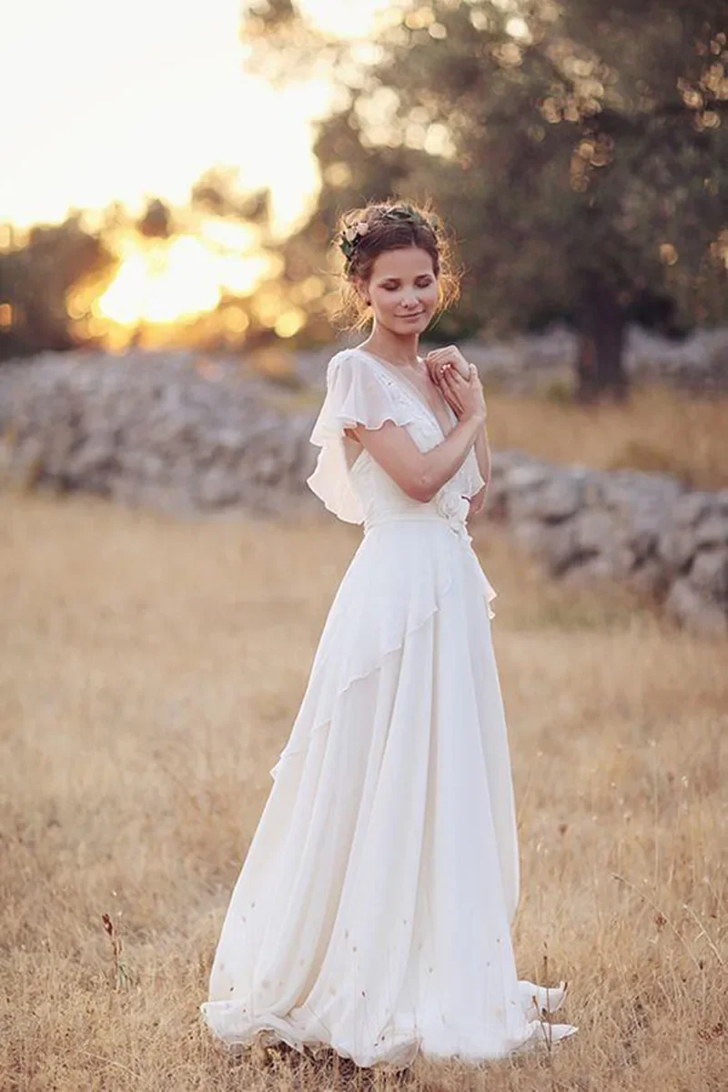 Boho V Neck Wedding Dresses Chiffon A Line Short Sleeves Backless Floor Length Ruffles Beach Bridal Gowns Bohemian 2024 Summer
Boho V Neck Wedding Dresses Chiffon A Line Short Sleeves Backless Floor Length Ruffles Beach Bridal Gowns Bohemian 2024 Summer