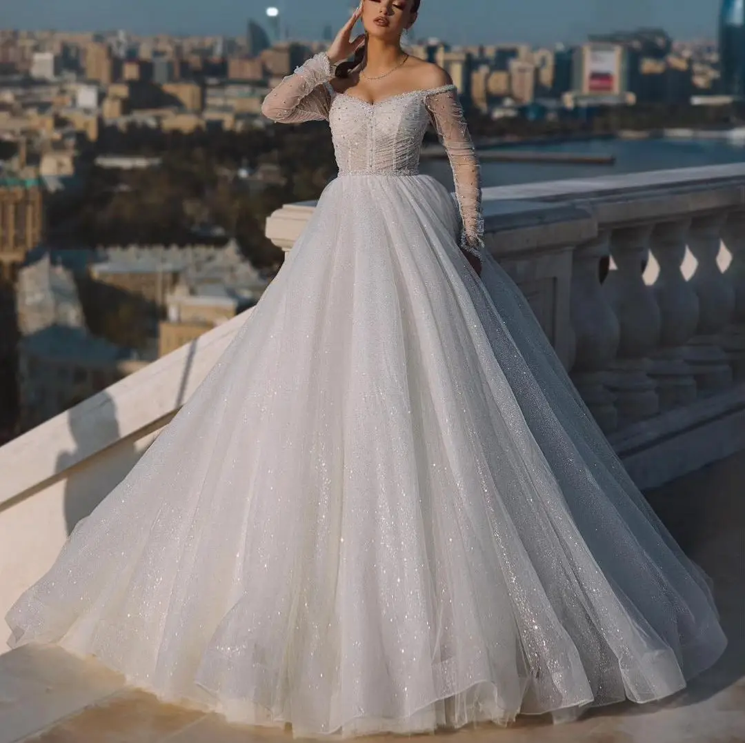 Ball Gown Wedding Dresses Long Sleeves Bateau Off Shoulder Sequins Ruffles Appliques Pearls Lace-upBridal Gowns Vestina De Novia
Ball Gown Wedding Dresses Long Sleeves Bateau Off Shoulder Sequins Ruffles Appliques Pearls Lace-upBridal Gowns Vestina De Novia