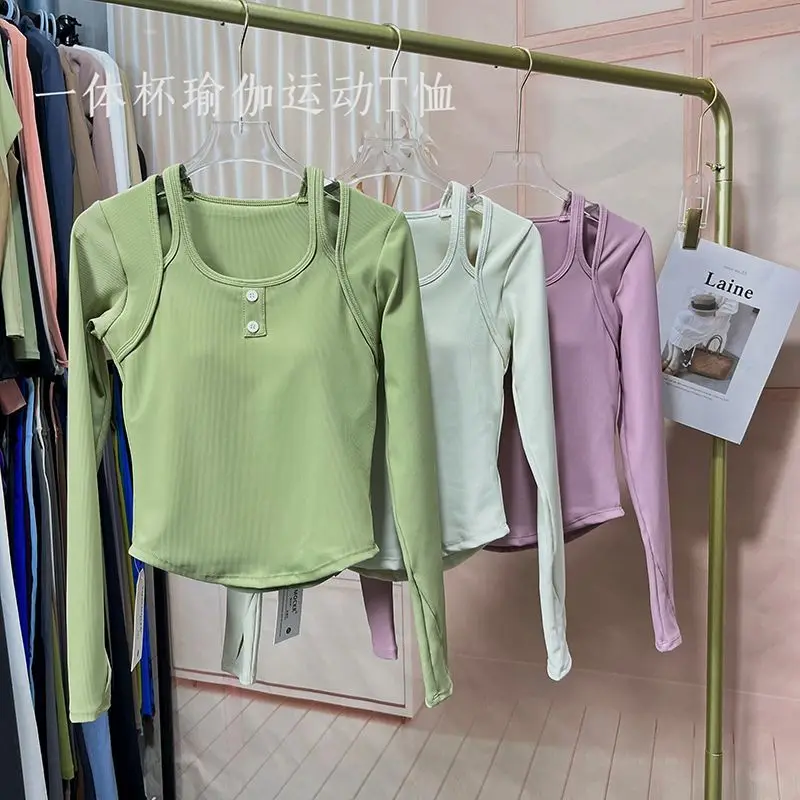 Sexy fixed chest cushion yoga suit for women, quick drying and slimming fitness top, slim fit elastic sports long sleeves 
Sexy fixed chest cushion yoga suit for women, quick drying and slimming fitness top, slim fit elastic sports long sleeves