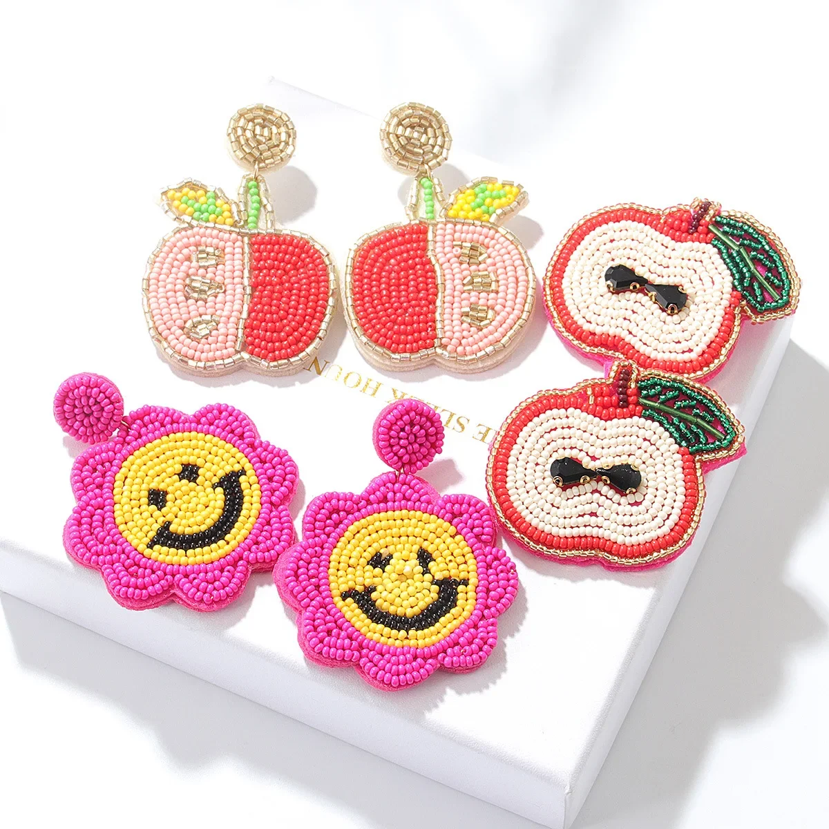 

Fringed earrings Hand woven smiling face flower Beading Simplicity Versatile Bohemia alloy ma'am Rice bead earrings