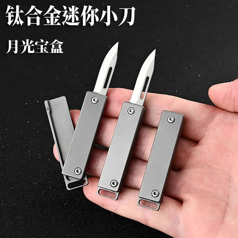 

Creative Titanium Alloy Mini Folding Knife D2 Steel Sharp Express Knife Carry on Keychain Open Box Tool Gift Pocket Knife