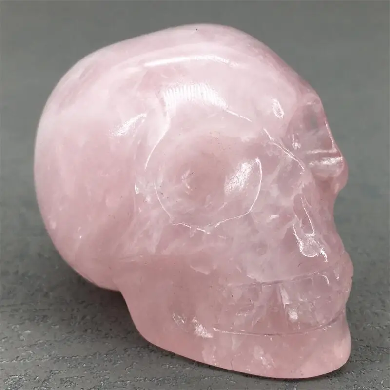 

Natural Rose Quartz Skull Mineral Gems Ghost Head Carved Reiki Healing Gift Crafts Feng Shui Home Decoration Stone Statue 1pcs