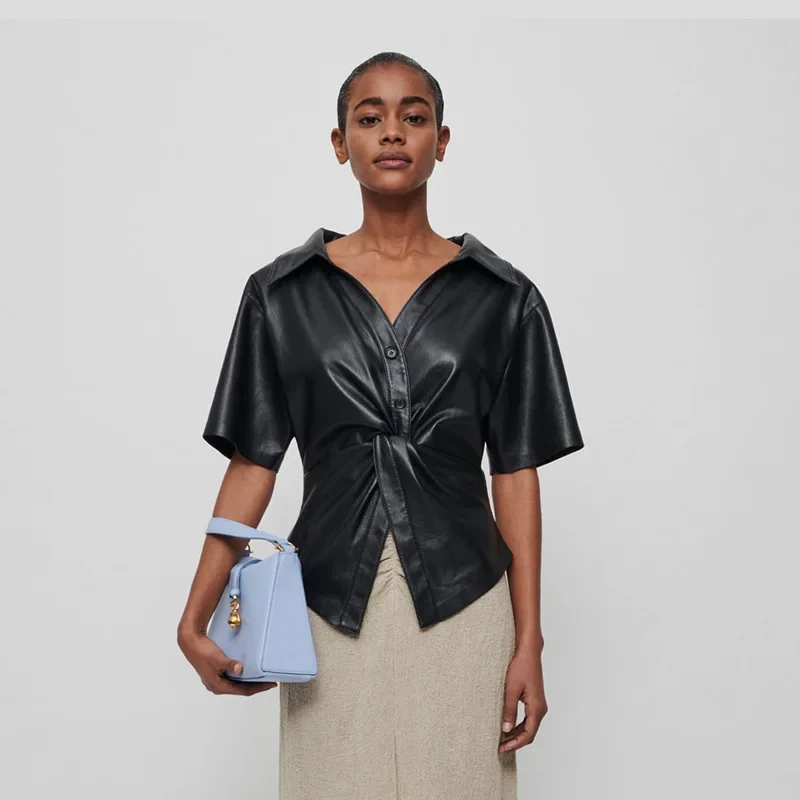 Spring/Summer Temperament Simple Commuter Faux Leather Twisted V-Neck Short Sleeve Shirt Women Blouse Tops.
Spring/Summer Temperament Simple Commuter Faux Leather Twisted V-Neck Short Sleeve Shirt Women Blouse Tops.