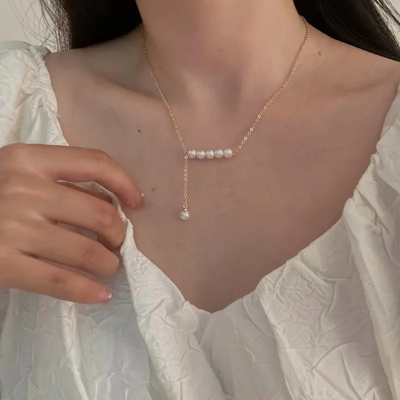 Design sense Balance beam pearl tassel pendant women's necklace collarbone chain Korean ins style
Design sense Balance beam pearl tassel pendant women's necklace collarbone chain Korean ins style