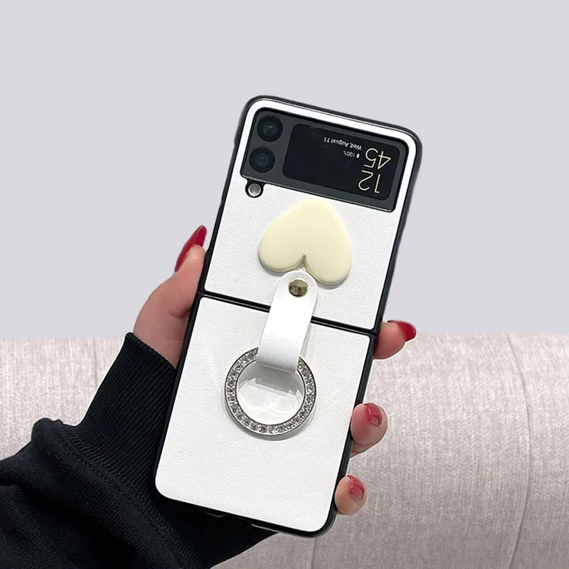 Чехол для Samsung ZFlip3, ударопрочный чехол с белым кольцом для Galaxy Z Flip3, кожаный чехол с рисунком в форме сердца, чехол Etui
Чехол для Samsung ZFlip3, ударопрочный чехол с белым кольцом для Galaxy Z Flip3, кожаный чехол с рисунком в форме сердца, чехол Etui