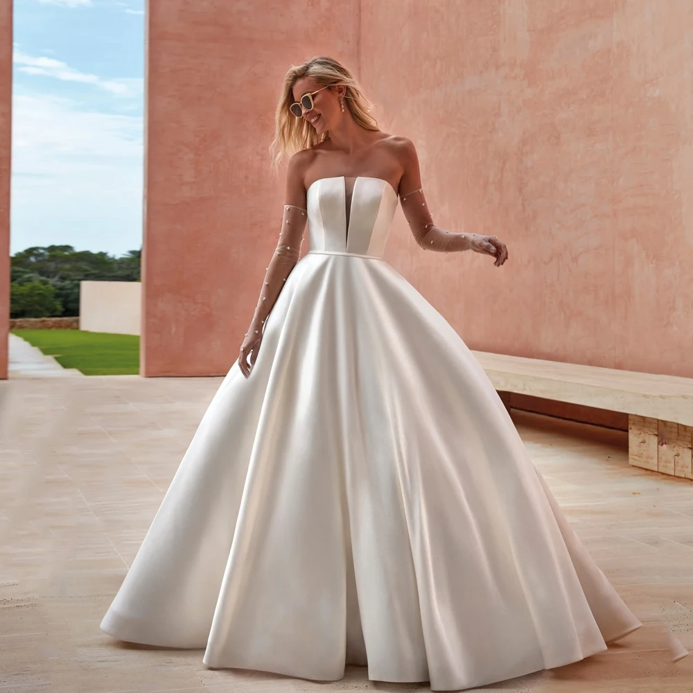 Женское ТРАПЕЦИЕВИДНОЕ свадебное платье, элегантное атласное платье до пола без бретелек, на пуговицах сзади, модель 2024 
Женское ТРАПЕЦИЕВИДНОЕ свадебное платье, элегантное атласное платье до пола без бретелек, на пуговицах сзади, модель 2024