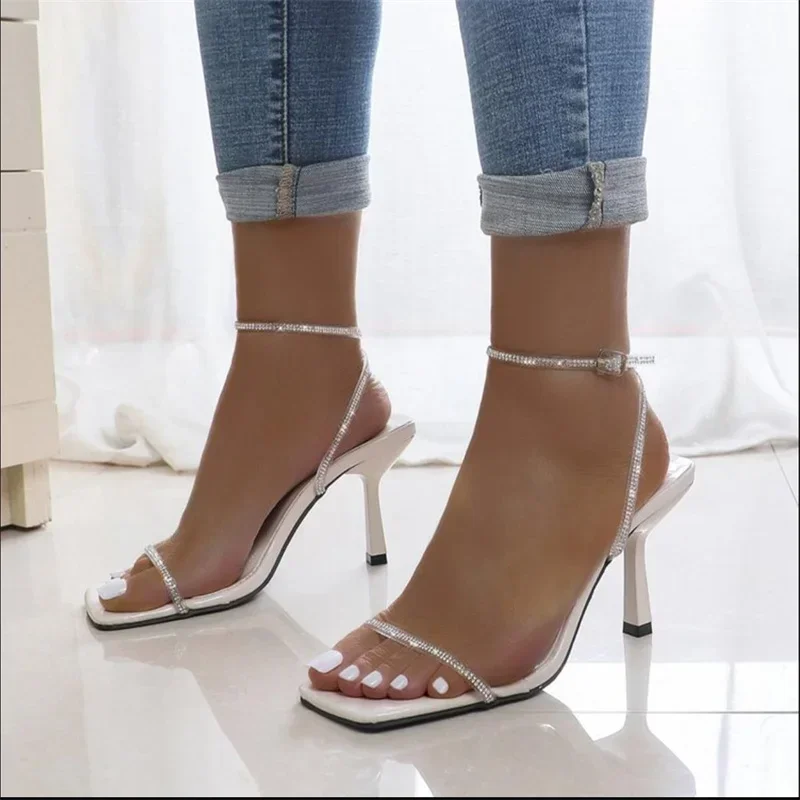 Summer sexy one line rhinestone with fashionable and versatile square toe slim high heels sandals
Summer sexy one line rhinestone with fashionable and versatile square toe slim high heels sandals