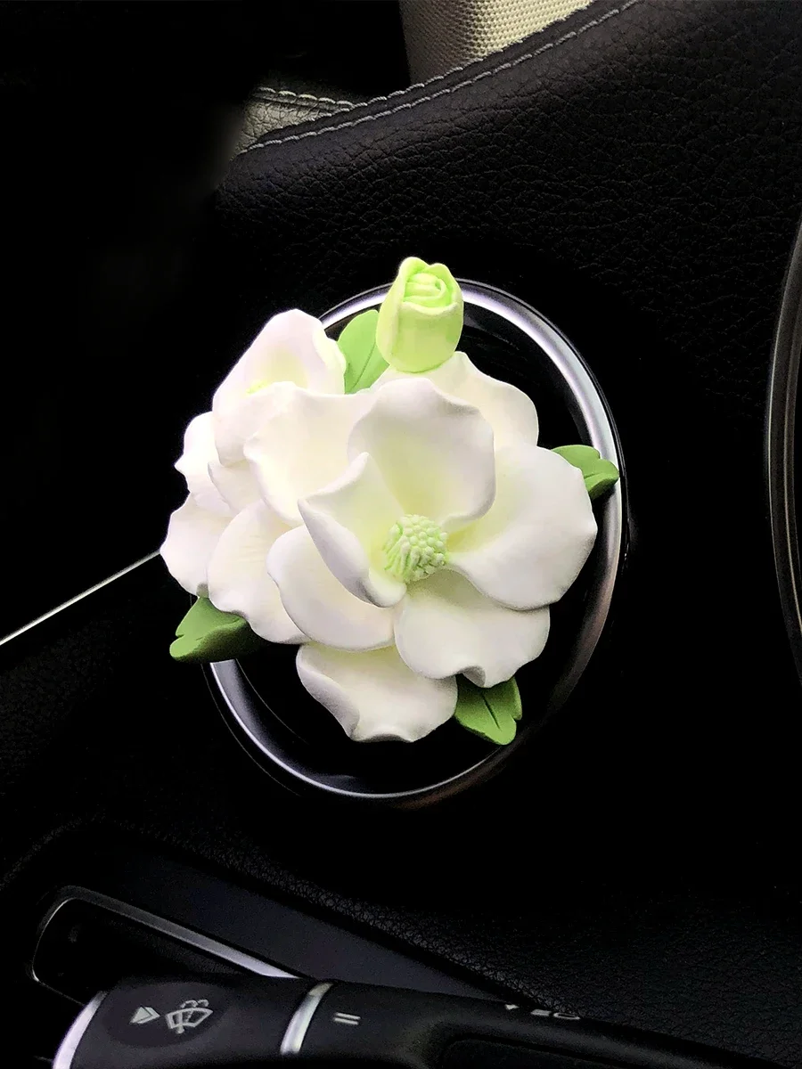 

Car interior air conditioning air outlet aromatherapy camellia fragrance expansion stone decoration car interior girl gift