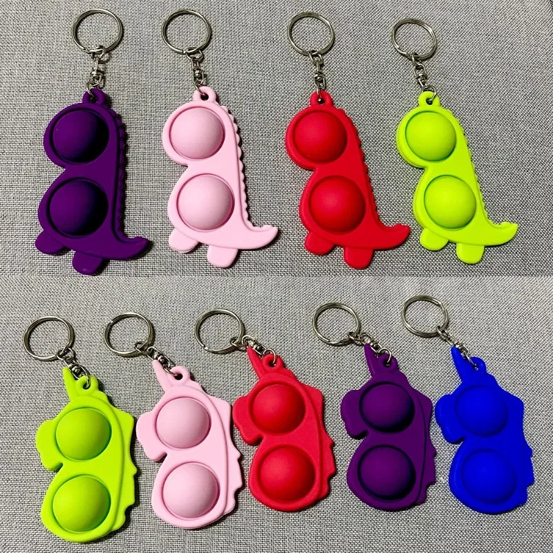 

Hot Selling Dinosaur Rodent Killer Pioneer Keychain, Finger Bubble Music, Decompression Unicorn Children's Silicone Toy in Stock