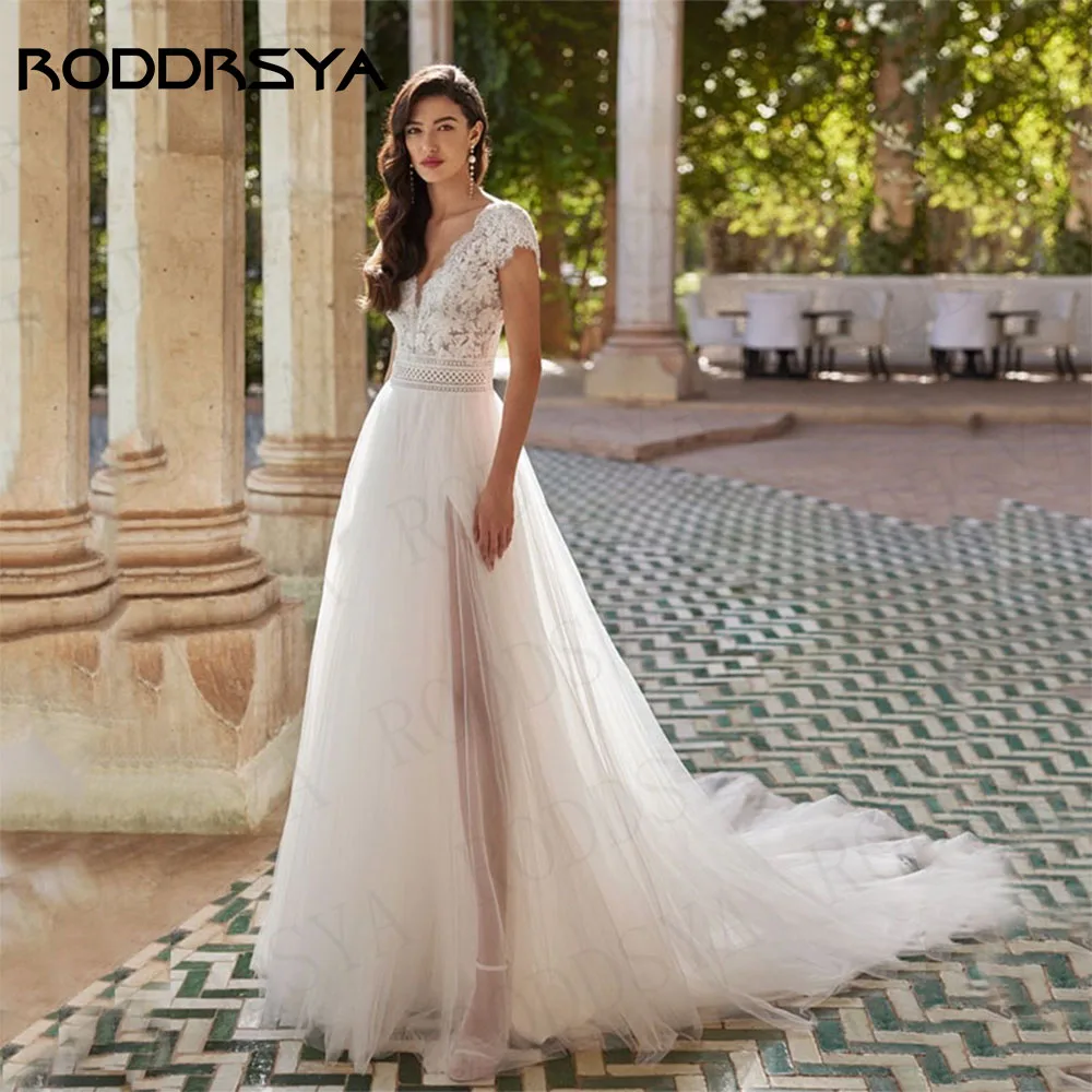 RODDRSYA Boho Backless Slit Wedding Dresses Short Sleeves Beach V Neck Tulle Bridal Gown Elegant Lace A Line Vestido De Novia
RODDRSYA Boho Backless Slit Wedding Dresses Short Sleeves Beach V Neck Tulle Bridal Gown Elegant Lace A Line Vestido De Novia